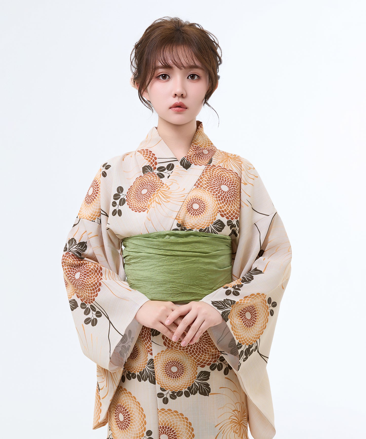Woman wearing a traditional kimono with floral patterns on a white background