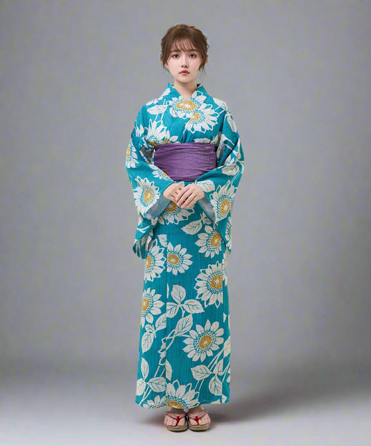 Woman wearing a blue floral kimono on a white background